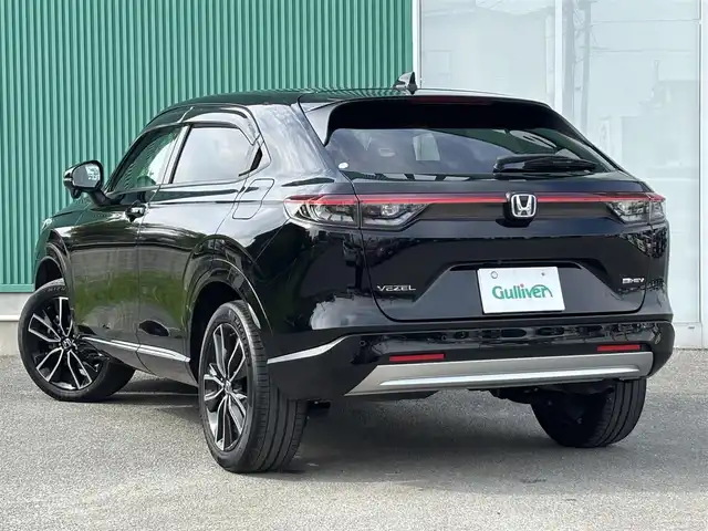 ホンダ ヴェゼル ハイブリッド e:HEV Z 福岡県 2021(令3)年 7.4万km クリスタルブラックパール ワンオーナー/純正9型ナビ(BT/AM/FM)/フルセグTV/ハンズフリーパワーバックドア/バックカメラ/ドライブレコーダー/渋滞追従機能付アダプティブクルーズコントロール/ソナーセンサー/ホンダセンシング/・衝突軽減ブレーキ/・誤発進抑制機能(前後)/・近距離衝突軽減ブレーキ/・歩行者事故軽減ステアリング/・車線維持支援システム/・先行車発進お知らせ機能/・標識認識機能/・オートハイビーム/フルLEDヘッドランプ(オートレベリング機構)/本革巻きステアリング/ステアリングヒーター/パドルシフト/合皮/ファブリックコンビシート/前席シートヒーター/純正18インチアルミホイール/スマートキー/禁煙車