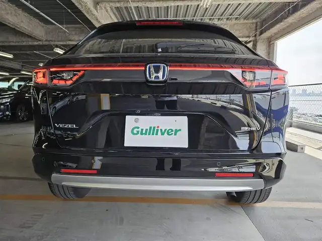 ホンダ ヴェゼル ハイブリッド e:HEV Z 福岡県 2021(令3)年 7.4万km クリスタルブラックパール ワンオーナー/純正9型ナビ(BT/AM/FM)/フルセグTV/ハンズフリーパワーバックドア/バックカメラ/ドライブレコーダー/渋滞追従機能付アダプティブクルーズコントロール/ソナーセンサー/ホンダセンシング/・衝突軽減ブレーキ/・誤発進抑制機能(前後)/・近距離衝突軽減ブレーキ/・歩行者事故軽減ステアリング/・車線維持支援システム/・先行車発進お知らせ機能/・標識認識機能/・オートハイビーム/フルLEDヘッドランプ(オートレベリング機構)/本革巻きステアリング/ステアリングヒーター/パドルシフト/合皮/ファブリックコンビシート/前席シートヒーター/純正18インチアルミホイール/スマートキー/禁煙車