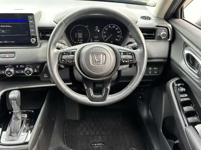ホンダ ヴェゼル ハイブリッド e:HEV Z 福岡県 2021(令3)年 7.4万km クリスタルブラックパール ワンオーナー/純正9型ナビ(BT/AM/FM)/フルセグTV/ハンズフリーパワーバックドア/バックカメラ/ドライブレコーダー/渋滞追従機能付アダプティブクルーズコントロール/ソナーセンサー/ホンダセンシング/・衝突軽減ブレーキ/・誤発進抑制機能(前後)/・近距離衝突軽減ブレーキ/・歩行者事故軽減ステアリング/・車線維持支援システム/・先行車発進お知らせ機能/・標識認識機能/・オートハイビーム/フルLEDヘッドランプ(オートレベリング機構)/本革巻きステアリング/ステアリングヒーター/パドルシフト/合皮/ファブリックコンビシート/前席シートヒーター/純正18インチアルミホイール/スマートキー/禁煙車