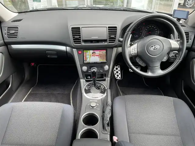 スバル レガシィ Ｂ４ 2．0GT スペックB 道央・札幌 2007(平19)年 2.6万km オブシディアンブラックパール 登録時走行距離25454ｋｍ/　４　W　D　/寒冷地仕様/Tuned by Sti仕様/Stiフロントスポイラー/RAYS　18インチホイール/社外メモリナビ（CD/DVD/FM/AM/SD)/ワンセグ（走行中視聴可能）/バックカメラ/ウィンカーミラー/ドアバイザー/プッシュスタート/ETC/MTモード付AT/スマートキー/ドライブレコーダー(前後)/パワーシート（運転席）/純正フロアマット/STIエアロ/盗難防止装置/フォグランプ/リアフォグ/革巻きステアリング/ステアリングスイッチ/パドルシフト/フロントデアイサースイッチ/電動格納ミラー/ワイパー間欠時間コントローラー/SI-DRIVE/momoステアリング/バニティミラー