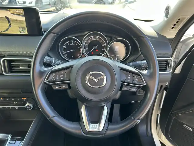 マツダ ＣＸ－５ 25S Lパッケージ 愛媛県 2021(令3)年 2.4万km スノーフレイクホワイトパールマイカ 純正SDナビ（Bluetooth/フルセグTV）/BOSEサウンド/全周囲カメラ/ヘッドアップディスプレイ/ブラックレザーシート/全席シートヒーター/パワーシート/D席シートメモリ機能/ステアリングリモコン/ステアリングヒーター/ETC2.0/ドライブレコーダー/前後コーナーセンサー/LEDヘッドライト