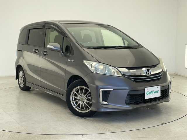 ホンダ フリード ハイブリット 千葉県 2014(平26)年 2.3万km モダンスティールM クルーズコントロール/純正メモリナビ　/バックカメラ　/ＥＴＣ　/スマートキー　/両側パワースライドドア　/電動格納ミラー　/社外サイドバイザー　　/ＬＥＤヘッドライト　/Ｗエアバッグ　/社外スタッドレスタイヤ有