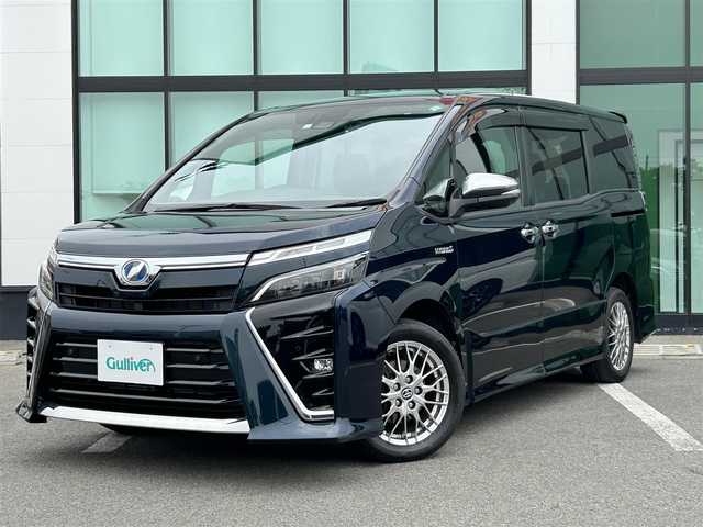 トヨタ ヴォクシー ハイブリッド ZS 煌Ⅱ 和歌山県 2020(令2)年 6.4万km ブラッキッシュアゲハガラスフレーク 純正ナビ/フルセグTV/バックカメラ/（BT/CD/DVD)/プリクラッシュセーフティー/クルーズコントロール/レーンキープ/クリアランスソナー/両側パワースライドドア/ドライブレコーダー/ETC/シートヒーター/純正フロアマット/純正アルミホイール/アイドリングストップ/LEDヘッドライト/フォグランプ/オートライト/オートマチックハイビーム
