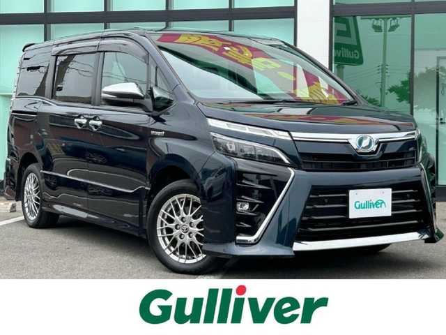 トヨタ ヴォクシー ハイブリッド ZS 煌Ⅱ 和歌山県 2020(令2)年 6.4万km ブラッキッシュアゲハガラスフレーク 純正ナビ/フルセグTV/バックカメラ/（BT/CD/DVD)/プリクラッシュセーフティー/クルーズコントロール/レーンキープ/クリアランスソナー/両側パワースライドドア/ドライブレコーダー/ETC/シートヒーター/純正フロアマット/純正アルミホイール/アイドリングストップ/LEDヘッドライト/フォグランプ/オートライト/オートマチックハイビーム