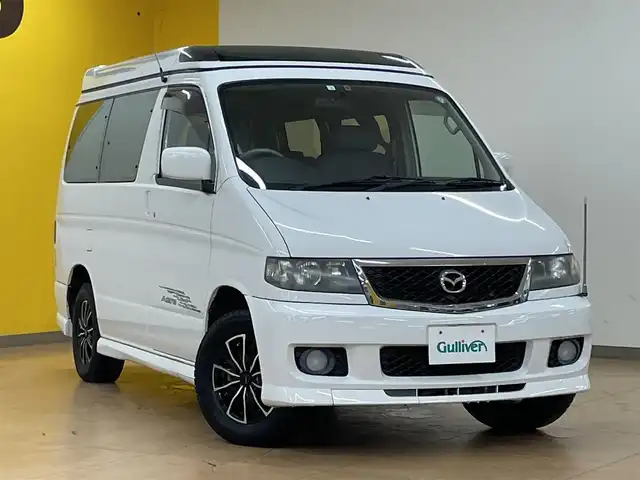 マツダ ボンゴ フレンディ RS－V エアロ 群馬県 2005(平17)年 7.8万km ピュアホワイト オートフリートップ/純正エアロ/DVDナビ/・CD/MD/・FM/AM/バックカメラ/片側スライドドア/電動サンシェード/ETC/純正フロアマット/社外15インチAW/純正15インチAW積込/ドアバイザー/革巻きステアリング/電動格納ミラー