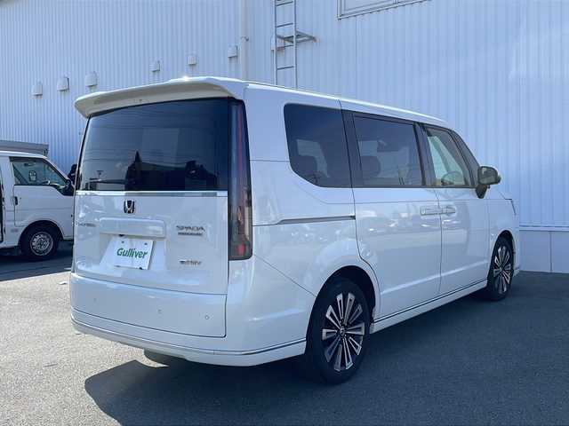 ホンダ ステップワゴン スパーダ eHEV プレミアムライン 三重県 2023(令5)年 4.6万km プラチナホワイトパール 禁煙車　/純正９型ナビ　/全周囲カメラ　/両側電動スライド　/ブラインドスポットモニター　/純正ドライブレコーダー　/電動リアゲート　/前席、２列目シートヒーター　/２列目オットマン　/ＵＳＢ、タイプＣ充電スポット/ステアリングスイッチ/TVキャンセラー/LEDヘッドライト/フォグランプ