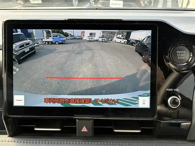 トヨタ ヴォクシー S－Z 熊本県 2023(令5)年 3.4万km ホワイトパールクリスタルシャイン 純正ディスプレイオーディオ（ナビ機能付き）/【フルセグTV/CD/DVD/Bluetooth/Miracast】/バックカメラ/フリップダウンモニター（V14T-R72R)/両側パワースライドドア/レーダークルーズコントロール/衝突被害軽減システム/レーンキープアシスト/クリアランスソナー/黒ハーフレザーシート/前席シートヒーター/純正17インチアルミホイル/LEDオートヘッドライト/フォグ/ETC2.0/アイドリングストップ/横滑り防止装置/純正フロアマット/保証書/取扱説明書
