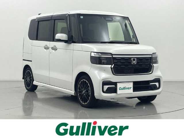 ホンダ Ｎ ＢＯＸ カスタム ターボ コーディネートS 熊本県 2024(令6)年 1.2万km パール ワンオーナー　/禁煙車　/純正9インチナビ（ＣＤ・ＤＶＤ・フルセグ・ＢＴ・ＳＤ・ＡｐｐｌＣａｒＰｌａｙ・AndroidAuto・ipod）/バックカメラ　/純正前後ドライブレコーダー　/ビルトインＥＴＣ　/ホンダセンシング/・衝突軽減ブレーキ/・急アクセル抑制機能/・誤発進制御機能/・近距離衝突軽減ブレーキ/・歩行者事故低減ステアリング/・路外逸脱抑制機能/・アダブティブクルーズコントロール/横滑り防止/アイドリングストップ/前後クリアランスソナー　/両側パワースライドドア/前席シートヒーター/純正フロアマット/純正１５インチAW/オートライト/LEDヘッドライト/フォグランプ/スマートキー/プッシュスタート/スペアキー1本/保証書/取扱説明書