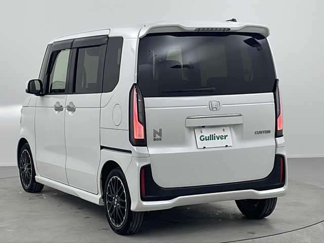 ホンダ Ｎ ＢＯＸ カスタム ターボ コーディネートS 熊本県 2024(令6)年 1.2万km パール ワンオーナー　/禁煙車　/純正9インチナビ（ＣＤ・ＤＶＤ・フルセグ・ＢＴ・ＳＤ・ＡｐｐｌＣａｒＰｌａｙ・AndroidAuto・ipod）/バックカメラ　/純正前後ドライブレコーダー　/ビルトインＥＴＣ　/ホンダセンシング/・衝突軽減ブレーキ/・急アクセル抑制機能/・誤発進制御機能/・近距離衝突軽減ブレーキ/・歩行者事故低減ステアリング/・路外逸脱抑制機能/・アダブティブクルーズコントロール/横滑り防止/アイドリングストップ/前後クリアランスソナー　/両側パワースライドドア/前席シートヒーター/純正フロアマット/純正１５インチAW/オートライト/LEDヘッドライト/フォグランプ/スマートキー/プッシュスタート/スペアキー1本/保証書/取扱説明書