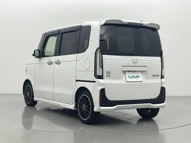 ホンダ Ｎ ＢＯＸ カスタム ターボ コーディネートS 熊本県 2024(令6)年 1.2万km パール ワンオーナー　/禁煙車　/純正9インチナビ（ＣＤ・ＤＶＤ・フルセグ・ＢＴ・ＳＤ・ＡｐｐｌＣａｒＰｌａｙ・AndroidAuto・ipod）/バックカメラ　/純正前後ドライブレコーダー　/ビルトインＥＴＣ　/ホンダセンシング/・衝突軽減ブレーキ/・急アクセル抑制機能/・誤発進制御機能/・近距離衝突軽減ブレーキ/・歩行者事故低減ステアリング/・路外逸脱抑制機能/・アダブティブクルーズコントロール/横滑り防止/アイドリングストップ/前後クリアランスソナー　/両側パワースライドドア/前席シートヒーター/純正フロアマット/純正１５インチAW/オートライト/LEDヘッドライト/フォグランプ/スマートキー/プッシュスタート/スペアキー1本/保証書/取扱説明書