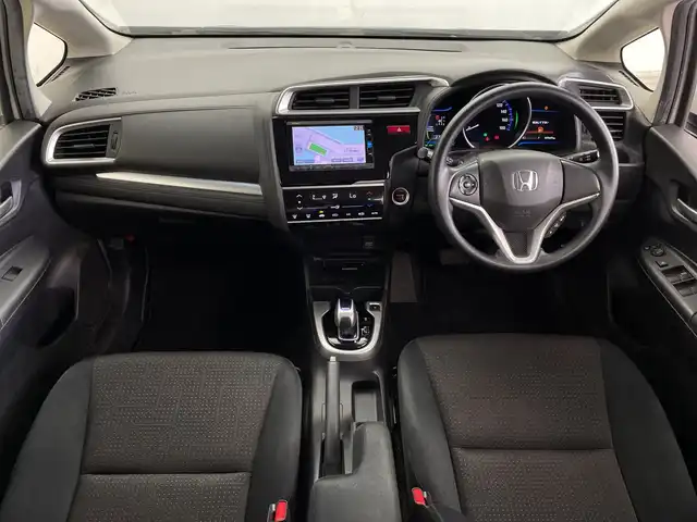 ホンダ フィット ハイブリット Fパッケージ 鹿児島県 2016(平28)年 14.8万km プレミアムホワイトパールⅡ 純正メモリナビ/(BT/CD/DVD/AM/FM/フルセグTV)/バックカメラ/ステアリングスイッチ/ETC/電動格納ミラー/純正フロアマット/純正ドアバイザー/パワーウィンドウ/パワーステアリング/保証書/取扱説明書