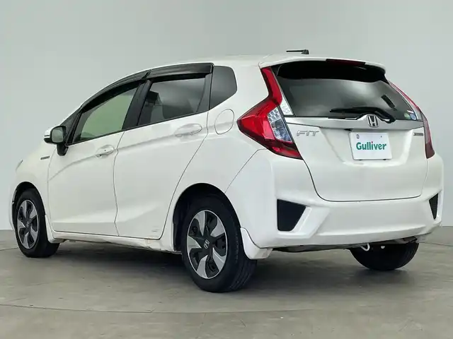 ホンダ フィット ハイブリット Fパッケージ 鹿児島県 2016(平28)年 14.8万km プレミアムホワイトパールⅡ 純正メモリナビ/(BT/CD/DVD/AM/FM/フルセグTV)/バックカメラ/ステアリングスイッチ/ETC/電動格納ミラー/純正フロアマット/純正ドアバイザー/パワーウィンドウ/パワーステアリング/保証書/取扱説明書