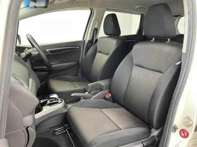 ホンダ フィット ハイブリット Fパッケージ 鹿児島県 2016(平28)年 14.8万km プレミアムホワイトパールⅡ 純正メモリナビ/(BT/CD/DVD/AM/FM/フルセグTV)/バックカメラ/ステアリングスイッチ/ETC/電動格納ミラー/純正フロアマット/純正ドアバイザー/パワーウィンドウ/パワーステアリング/保証書/取扱説明書