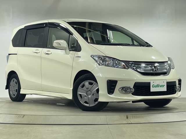 ホンダ フリード ハイブリット 神奈川県 2013(平25)年 3.2万km プレミアムホワイトパール 純正9インチナビ【VXM-135VFN】/AM　FM　DVD　CD　Bluetooth/片側パワースライドドア/バックカメラ/クルーズコントロール/ETC/スマートキー×2/純正フロアマット/保証書/取扱説明書/前後ドライブレコーダー/ディスチャージヘッドライト/フォグランプ/電動格納ミラー/VSA