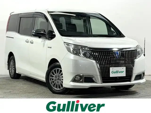 トヨタ エスクァイア ハイブリッド Gi 大阪府 2015(平27)年 6.8万km ホワイトパールクリスタルシャイン 黒革シート 純正9incナビTV 360カメラ フリップダウンモニター シートヒーター クルーズコントロール 衝突軽減ブレーキ 両側パワースライドドア リアオートエアコン ドライブレコーダー 置き型充電 ETC