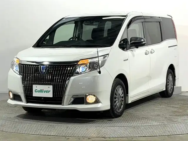 トヨタ エスクァイア ハイブリッド Gi 大阪府 2015(平27)年 6.8万km ホワイトパールクリスタルシャイン 黒革シート 純正9incナビTV 360カメラ フリップダウンモニター シートヒーター クルーズコントロール 衝突軽減ブレーキ 両側パワースライドドア リアオートエアコン ドライブレコーダー 置き型充電 ETC