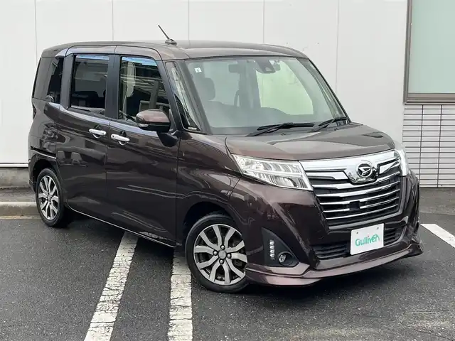ダイハツ トール カスタムG ターボ SAⅡ 三重県 2017(平29)年 7.3万km プラムブラウンクリスタルマイカ パノラマモニター/ドライブレコーダー（前）/アルパイン9インチナビ（Bluetooth/地デジTV/DVD/CD/SD/AM/FM）/スマートアシスト2（衝突回避支援ブレーキ/対車両・歩行者衝突警報/車線逸脱警報/誤発進抑制制御/先行車発進お知らせ）/コンフォートパック（前席シートヒーター/シートバックテーブル）/パワースライドドア（運転席側/助手席側）/LEDヘッドランプ/オートライト/LEDフロントフォグランプ/イルミネーションランプ/ステアリングスイッチ（カラーマルチインフォメーションディスプレイ/スポーツモード/オーディオ）/撥水機能付ブラックファブリックシート/シートリフター（運転席）/シートアンダートレイ（助手席）/シートバックポケット（助手席）/スペアキー