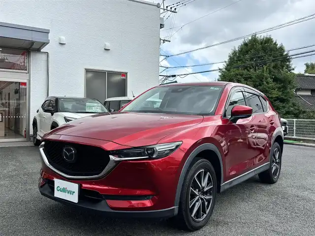 マツダ ＣＸ－５ XD Lパッケージ 熊本県 2017(平29)年 9.5万km ソウルレッドクリスタルM メーカーナビ/【フルセグTV/Bluetooth/CD/DVD/USB】/バックモニター/サイドモニター（左側）/レーダークルーズコントロール/衝突軽減防止装置/ブラインドスポットモニター/レーンキープアシスト/ヘッドアップディスプレイ/ブレーキホールド/パワーバックドア/パワーシート（D席N席）/シートヒーター/ステアリングヒーター/ステアリングスイッチ/社外ドラレコ/ETC/オートライトLED/オートマチックハイビーム/純正19インチアルミホイール/革巻きステアリング/本革シート/純正フロアマット/プッシュスタート/スマートキー/TCF/盗難防止装置/保証書/取扱説明書/スペアキー