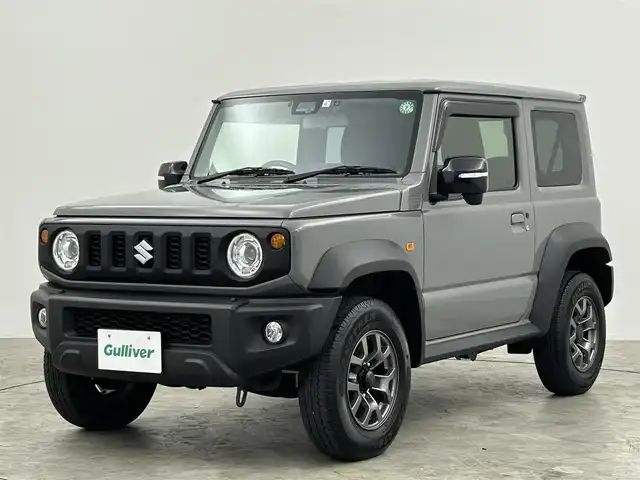 スズキ ジムニー シエラ JC 群馬県 2023(令5)年 1.5万km ミディアムグレー 社外７インチナビ　バックカメラ　衝突軽減ブレーキ　車線逸脱警報　クルーズコントロール　オートハイビーム　ダウンヒルアシストコントロール　シートヒーター　ステアリングスイッチ　ＬＥＤヘッドライト　禁煙車