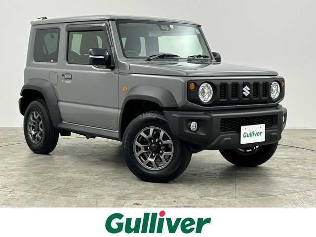 スズキ ジムニー シエラ JC 群馬県 2023(令5)年 1.5万km ミディアムグレー 社外７インチナビ　バックカメラ　衝突軽減ブレーキ　車線逸脱警報　クルーズコントロール　オートハイビーム　ダウンヒルアシストコントロール　シートヒーター　ステアリングスイッチ　ＬＥＤヘッドライト　禁煙車