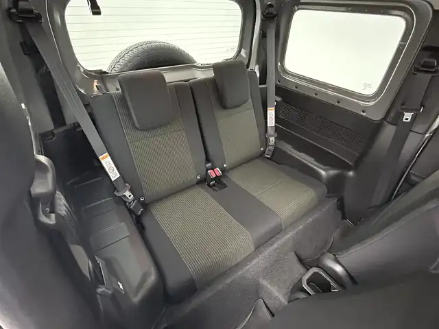 スズキ ジムニー シエラ JC 群馬県 2023(令5)年 1.5万km ミディアムグレー 社外７インチナビ　バックカメラ　衝突軽減ブレーキ　車線逸脱警報　クルーズコントロール　オートハイビーム　ダウンヒルアシストコントロール　シートヒーター　ステアリングスイッチ　ＬＥＤヘッドライト　禁煙車