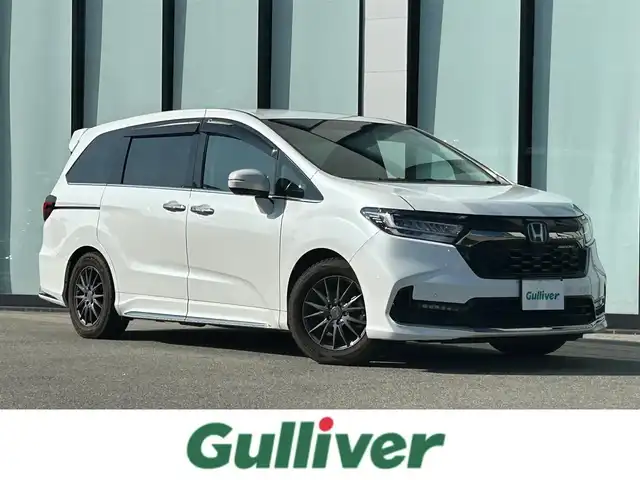 ホンダ オデッセイ アブソルート EX 大阪府 2021(令3)年 2.1万km プラチナホワイトパール 純正１０インチナビ/   フルセグTV/CD/DVD/Bluetooth/USB/全方位モニター/１１．６インチ後席モニター/衝突軽減ブレーキ/横滑り防止装置/コーナーセンサー/ＢＳＭ/前席シートヒーター/前席パワーシート/電動リアゲート/両側パワースライドドア/レーダークルーズコントロール/レーンキープアシスト/パドルシフト/アイドリングストップ/前後ドライブレコーダー/VELVA SPORT 17インチアルミホイール/純正フロアマット/オットマン/プッシュスタート/スマートキー/ＥＴＣ/ＬＥＤ/禁煙車