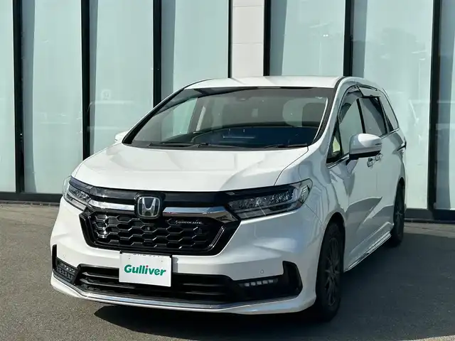 ホンダ オデッセイ アブソルート EX 大阪府 2021(令3)年 2.1万km プラチナホワイトパール 純正１０インチナビ/   フルセグTV/CD/DVD/Bluetooth/USB/全方位モニター/１１．６インチ後席モニター/衝突軽減ブレーキ/横滑り防止装置/コーナーセンサー/ＢＳＭ/前席シートヒーター/前席パワーシート/電動リアゲート/両側パワースライドドア/レーダークルーズコントロール/レーンキープアシスト/パドルシフト/アイドリングストップ/前後ドライブレコーダー/VELVA SPORT 17インチアルミホイール/純正フロアマット/オットマン/プッシュスタート/スマートキー/ＥＴＣ/ＬＥＤ/禁煙車