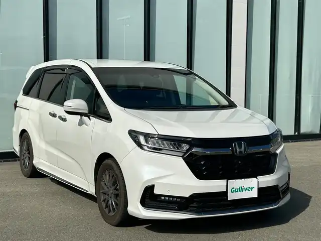 ホンダ オデッセイ アブソルート EX 大阪府 2021(令3)年 2.1万km プラチナホワイトパール 純正１０インチナビ/   フルセグTV/CD/DVD/Bluetooth/USB/全方位モニター/１１．６インチ後席モニター/衝突軽減ブレーキ/横滑り防止装置/コーナーセンサー/ＢＳＭ/前席シートヒーター/前席パワーシート/電動リアゲート/両側パワースライドドア/レーダークルーズコントロール/レーンキープアシスト/パドルシフト/アイドリングストップ/前後ドライブレコーダー/VELVA SPORT 17インチアルミホイール/純正フロアマット/オットマン/プッシュスタート/スマートキー/ＥＴＣ/ＬＥＤ/禁煙車