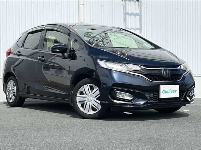 ホンダ フィット 13G FパックコンフォートED 三重県 2019(令1)年 9.9万km ミッドナイトブルービームM 純正ナビ /バックカメラ /ビルトインETC /前席シートヒーター /USB給電 /クルーズコントロール /レーンキープアシスト /LEDヘッドライト /オートライト /ステアリングスイッチ /純正フロアマット /電動格納ミラー/禁煙車