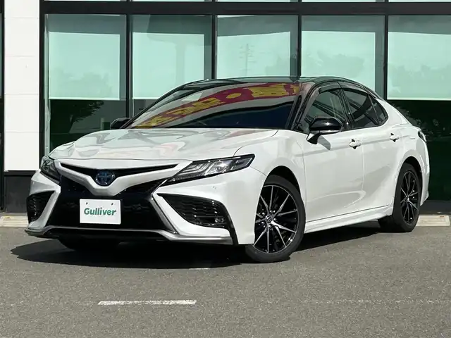 トヨタ カムリ WSレザーパッケージ 和歌山県 2021(令3)年 7万km アティチュードブラックマイカ/プラチナホワイトパールマイカ 純正ナビ/フルセグTV/Bluetooth/CD/DVD/USB/バックカメラ/ビルトインETC/前後ドライブレコーダー/トヨタセーフティセンス/BSM/レーダークルーズコントロール/レーンキープアシスト/クリアランスソナー/革巻きステアリング/ステアリングスイッチ/パドルシフト/レザーシート/前席パワーシート/前席シートヒーター/LEDヘッドライト/オートライト/オートハイビーム/純正18インチAW/ドアバイザー/純正フロアマット/プッシュスタート/スマートキー