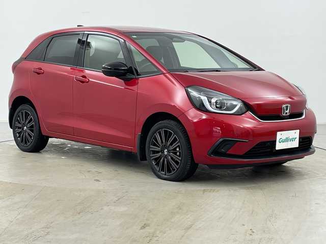 ホンダ フィット e:HEVホーム カーサ 道央・札幌 2022(令4)年 3.3万km プレミアムクリスタルレッドM ・4WD/・寒冷地仕様/・ホンダセンシング/・衝突被害軽減ブレーキ/・横滑り防止装置/・レーンキープアシスト/・クルーズコントロール/・純正9インチナビ/・BT&USB&フルセグTV/・ハーフレザーシート/・前席シートヒーター/・ビルトインETC2.0/・LEDヘッドライト/・オートライト/・スマートキー/・プッシュスタート