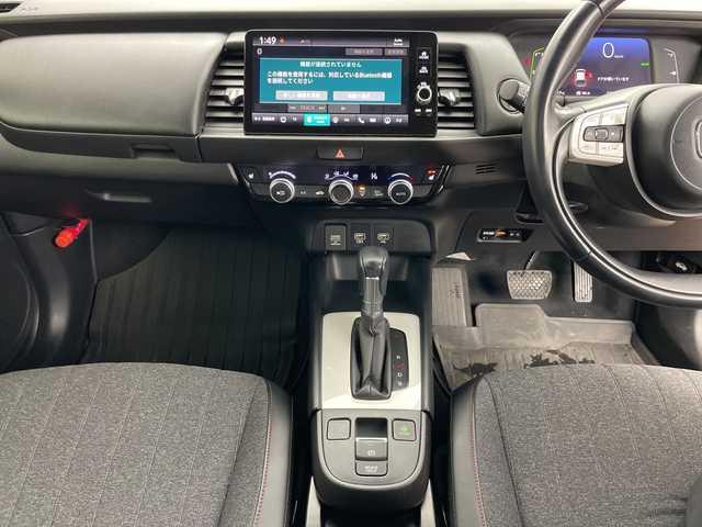 ホンダ フィット e:HEVホーム カーサ 道央・札幌 2022(令4)年 3.3万km プレミアムクリスタルレッドM ・4WD/・寒冷地仕様/・ホンダセンシング/・衝突被害軽減ブレーキ/・横滑り防止装置/・レーンキープアシスト/・クルーズコントロール/・純正9インチナビ/・BT&USB&フルセグTV/・ハーフレザーシート/・前席シートヒーター/・ビルトインETC2.0/・LEDヘッドライト/・オートライト/・スマートキー/・プッシュスタート