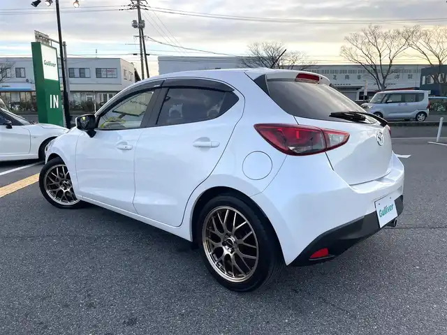 マツダ デミオ XD ツーリング 鳥取県 2015(平27)年 4.6万km スノーフレイクホワイトパールマイカ ディーゼル・ターボ/純正ナビ／フルセグ／ＤＶＤ／ＣＤ／ＢＴ/ＥＴＣ・ドライブレコーダー/衝突軽減ブレーキ/クルーズコントロール/パドルシフト/ＬＥＤヘットライト/フォグライト/ヘットアップディスプレイ/社外サスペンション（減衰調整付き）/社外１７インチアルミホイール/プッシュエンジンスタート/オートライト/フロアマット/ドアバイザー