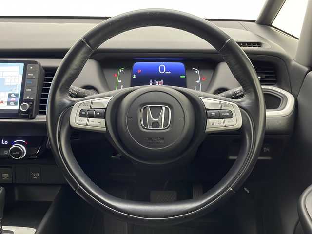 ホンダ フィット e:HEVホーム 宮崎県 2020(令2)年 9.9万km ライトブルー 禁煙車/ホンダセンシング/純正9型ナビTV/（VXU-205FTi/CD/DVD/MSV/Bluetooth/フルセグTV)/純正バックカメラ/純正LEDオートライト/純正フロアマット/アダプティブクルーズコントロール/レーンディパーチャーアラート/クリアランスソナー/電子パーキング/オートホールド/ウインカードアミラー/本革巻ハンドル/オートエアコン/スマートキー/プッシュエンジンスタート/新車時保証書/取扱い説明書