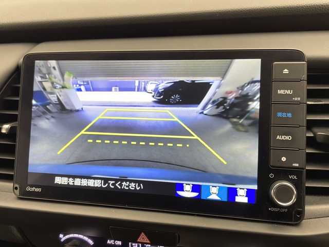 ホンダ フィット e:HEVホーム 宮崎県 2020(令2)年 9.9万km ライトブルー 禁煙車/ホンダセンシング/純正9型ナビTV/（VXU-205FTi/CD/DVD/MSV/Bluetooth/フルセグTV)/純正バックカメラ/純正LEDオートライト/純正フロアマット/アダプティブクルーズコントロール/レーンディパーチャーアラート/クリアランスソナー/電子パーキング/オートホールド/ウインカードアミラー/本革巻ハンドル/オートエアコン/スマートキー/プッシュエンジンスタート/新車時保証書/取扱い説明書