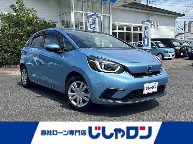 ホンダ フィット e:HEVホーム 愛知県 2020(令2)年 9.9万km ライトブルー (株)IDOMが運営する【じしゃロン名古屋鳴海店】の自社ローン専用車両になりますこちらは現金またはオートローンご利用時の価格です。自社ローンご希望の方は別途その旨お申付け下さい/禁煙車/ホンダセンシング/純正9型ナビTV/（VXU-205FTi/CD/DVD/MSV/Bluetooth/フルセグTV)/純正バックカメラ/純正LEDオートライト/純正フロアマット/アダプティブクルーズコントロール/レーンディパーチャーアラート/クリアランスソナー/電子パーキング/オートホールド/ウインカードアミラー/本革巻ハンドル/オートエアコン/スマートキー/プッシュエンジンスタート/新車時保証書/取扱い説明書
