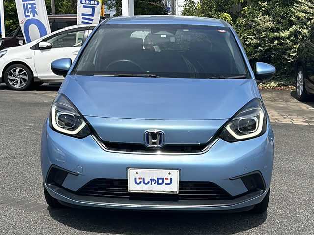 ホンダ フィット e:HEVホーム 愛知県 2020(令2)年 9.9万km ライトブルー (株)IDOMが運営する【じしゃロン名古屋鳴海店】の自社ローン専用車両になりますこちらは現金またはオートローンご利用時の価格です。自社ローンご希望の方は別途その旨お申付け下さい/禁煙車/ホンダセンシング/純正9型ナビTV/（VXU-205FTi/CD/DVD/MSV/Bluetooth/フルセグTV)/純正バックカメラ/純正LEDオートライト/純正フロアマット/アダプティブクルーズコントロール/レーンディパーチャーアラート/クリアランスソナー/電子パーキング/オートホールド/ウインカードアミラー/本革巻ハンドル/オートエアコン/スマートキー/プッシュエンジンスタート/新車時保証書/取扱い説明書
