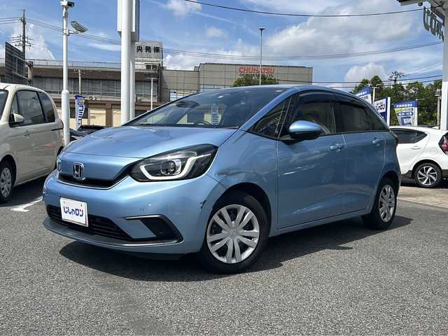 ホンダ フィット e:HEVホーム 愛知県 2020(令2)年 9.9万km ライトブルー (株)IDOMが運営する【じしゃロン名古屋鳴海店】の自社ローン専用車両になりますこちらは現金またはオートローンご利用時の価格です。自社ローンご希望の方は別途その旨お申付け下さい/禁煙車/ホンダセンシング/純正9型ナビTV/（VXU-205FTi/CD/DVD/MSV/Bluetooth/フルセグTV)/純正バックカメラ/純正LEDオートライト/純正フロアマット/アダプティブクルーズコントロール/レーンディパーチャーアラート/クリアランスソナー/電子パーキング/オートホールド/ウインカードアミラー/本革巻ハンドル/オートエアコン/スマートキー/プッシュエンジンスタート/新車時保証書/取扱い説明書