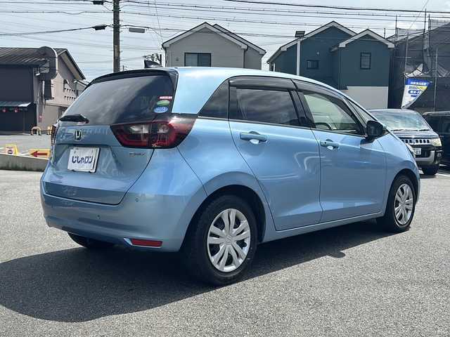 ホンダ フィット e:HEVホーム 愛知県 2020(令2)年 9.9万km ライトブルー (株)IDOMが運営する【じしゃロン名古屋鳴海店】の自社ローン専用車両になりますこちらは現金またはオートローンご利用時の価格です。自社ローンご希望の方は別途その旨お申付け下さい/禁煙車/ホンダセンシング/純正9型ナビTV/（VXU-205FTi/CD/DVD/MSV/Bluetooth/フルセグTV)/純正バックカメラ/純正LEDオートライト/純正フロアマット/アダプティブクルーズコントロール/レーンディパーチャーアラート/クリアランスソナー/電子パーキング/オートホールド/ウインカードアミラー/本革巻ハンドル/オートエアコン/スマートキー/プッシュエンジンスタート/新車時保証書/取扱い説明書