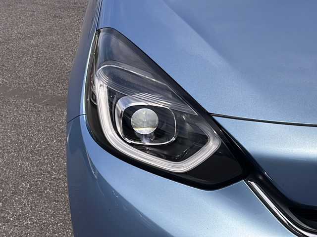 ホンダ フィット e:HEVホーム 愛知県 2020(令2)年 9.9万km ライトブルー (株)IDOMが運営する【じしゃロン名古屋鳴海店】の自社ローン専用車両になりますこちらは現金またはオートローンご利用時の価格です。自社ローンご希望の方は別途その旨お申付け下さい/禁煙車/ホンダセンシング/純正9型ナビTV/（VXU-205FTi/CD/DVD/MSV/Bluetooth/フルセグTV)/純正バックカメラ/純正LEDオートライト/純正フロアマット/アダプティブクルーズコントロール/レーンディパーチャーアラート/クリアランスソナー/電子パーキング/オートホールド/ウインカードアミラー/本革巻ハンドル/オートエアコン/スマートキー/プッシュエンジンスタート/新車時保証書/取扱い説明書