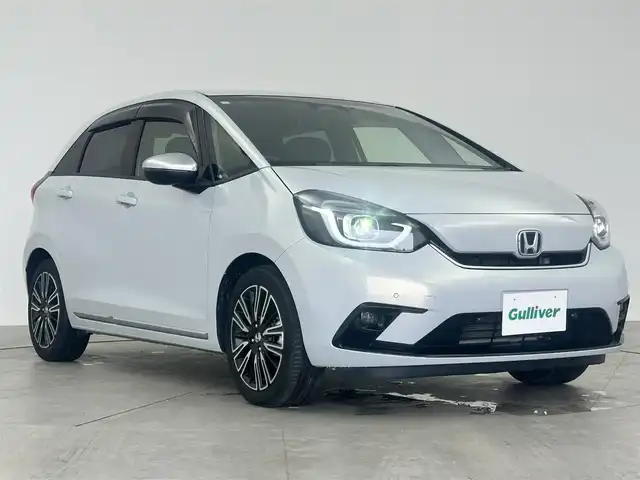 ホンダ フィット e:HEVリュクス 愛知県 2020(令2)年 2.5万km プレミアムサンライトホワイトパール ワンオーナー/ホンダセンシング/Gathers9インチナビ/バックカメラ/ハーフレザー/シートヒート/ステアリングヒーター/ドライブレコーダー/ACC/ドアバイザー/純正フロアマット/純正LEDライト/DVD再生可能/純正AW/USB端子入力