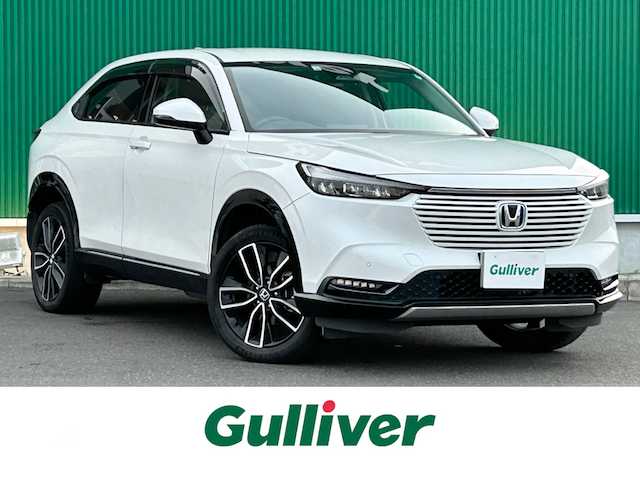 ホンダ ヴェゼル ハイブリッド e:HEV Z 宮城県 2022(令4)年 5.5万km プラチナホワイトパール Honda CONNECTディスプレー/・9インチワイドディスプレイ/・ナビ機能/・Bluetooth/・フルセグTV/＋ETC2.0車載器＋ワイヤレス充電器/後退出庫サポート/＝＝＝/ホンダセンシング/・衝突軽減ブレーキ/・誤発進抑制機能/・後方誤発進抑制機能/・近距離衝突軽減ブレーキ/・歩行者事故軽減ステアリング/・路外逸脱抑制機能/・渋滞追従機能付アダプティブクルーズコントロール/・車線維持支援システム/・先行車発進お知らせ機能/・標識認識機能/・オートハイビーム/・パーキングセンサーシステム/ブラインドスポットインフォメーション/ハンズフリーアクセスパワーテールゲート(予約クローズ機能付)/ハーフレザーシート/親水/ヒーテッドドアミラー/＋熱線入りフロントウインドウ/＋運転席助手席シートヒーター/LEDヘッドランプ/LEDシーケンシャルターンランプ/フォグランプ/電動パーキングブレーキ/ブレーキホールド/スマートキー＆プッシュスタート/純正18インチAW/フロアマット/ドアバイザー/W/サイド/カーテンエアバッグ