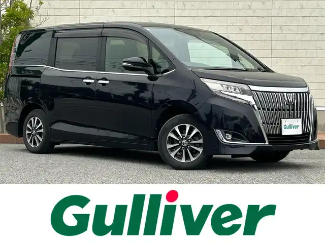 トヨタ エスクァイア Gi 滋賀県 2017(平29)年 4.2万km スパークリングブラックパールクリスタルシャイン フリップダウンモニター/両側パワースライドドア/積込冬タイヤ/純正9インチナビ【NSZT-Y66T】/（AM/FM/CD/DVD/フルセグ/Bluetooth/HDMI）/バックカメラ/前方ドライブレコーダー/ETC2.0/トヨタセーフティセンス/・踏み間違い防止アシスト	/・ブレーキアシスト/・プリクラッシュブレーキアシスト/・ヒルスタート（坂道発進）アシスト/・前方衝突防止支援システム/・VDC（ビークルダイナミクスコントロール）/・レーンキープアシスト/・ASCD（オートスピードコントロール装置）/・ABS（アンチロックブレーキシステム）/運転席・助手席シートヒーター/電動格納ミラー/アイドリングストップ/ステアリングスイッチ/オートライト/オートハイビーム/LEDヘッドライト/フロントフォグ/フルオートエアコン/USB端子/プッシュスタート/スマートキー/純正フロアマット/ドアバイザー/ECOモード