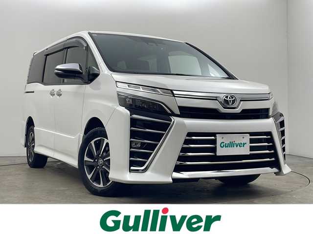 トヨタ ヴォクシー ZS 煌Ⅲ 秋田県 2021(令3)年 4.8万km ホワイトパールクリスタルシャイン 4WD/純正SDナビ　/両側パワースライドドア　/フリップダウンモニター　/フルセグTV/AM/FM/CD/バックカメラ　/衝突被害軽減ブレーキ　/クルーズコントロール　/レーンキープアシスト　/横滑り防止装置/前後コーナーセンサー/アイドリングストップ/ビルトインETC　/前後ドライブレコーダー　/LEDヘッドライト/オートマチックハイビーム/LEDフォグランプ/サイドバイザー/革巻きステアリング/純正アルミホイール/リアサンシェード