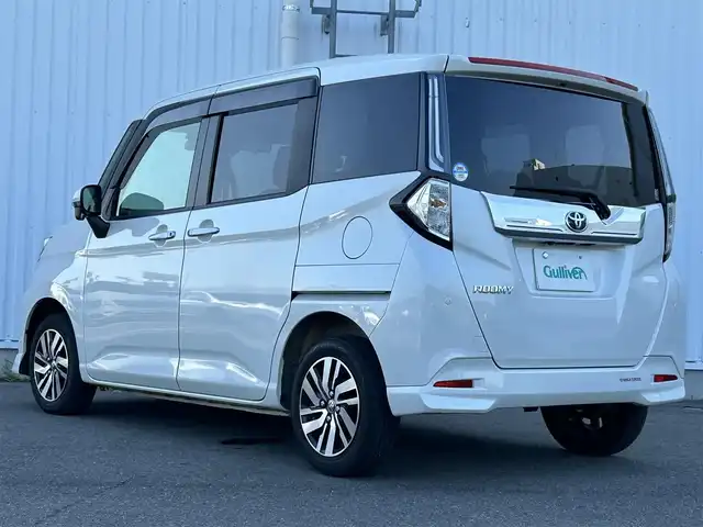 トヨタ ルーミー カスタムG 愛媛県 2021(令3)年 1.7万km パールホワイトⅢ 純正SDメモリーナビ/全方位カメラ/フルセグTV/CD/DVD再生/ETC/ミュージックサーバー（SD録音）/Bluetooth接続/アダプティブクルーズコントロール/両側パワースライドドア/純正フロアマット/純正14インチアルミホイール/LEDヘッドライト/コーナーセンサー/横滑り防止装置/衝突軽減ブレーキ/電動パーキングブレーキ/ブレーキホールド/ドライブレコーダー/充電用USBポート