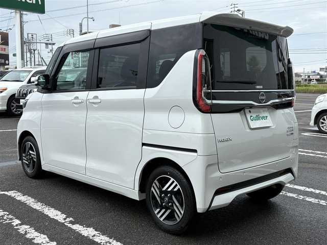 日産 ルークス HWS X プロパイロットED 徳島県 2024(令6)年 1.3万km ホワイトパール 純正ナビ　MM223D-Le/(AM/FM/BT/HDMI/SD/フルセグ)/バックカメラ/全周囲カメラ/ETC/両側電動スライドドア/追従式クルーズコントロール/ドライブレコーダー/インテリジェントルームミラー/コーナーセンサー/LEDヘッドライト/リヤシーリングファン/アイドリングストップ/オートライト/純正フロアマット/プロパイロット/エマージェンシーブレーキ/オートブレーキホールド/ドアバイザー/プッシュスタート/新車時保証書
