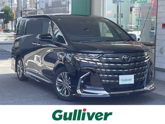 トヨタ アルファードハイブリット Z 愛知県 2024(令6)年 0.9万km ブラック ワンオーナー/モデリスタエアロキット/・フロント／サイド／リアアンダー／ドレスアップマフラー/黒合皮シート/前席2列目シートヒーター＆ベンチレーション/前席パワーシート/2列目エグゼクティブパワーシート/両側パワースライドドア/純正14型ディスプレイオーディオ/・車載ナビ／地デジTV／USB／HDMI/・Apple Car Play／Android Auto/パノラミックビューモニター〈床下透過表示機能〉/純正13.2型有機ELフリップダウンモニター/デジタルインナーミラー/ビルトインETC2.0/ワイヤレス充電/3眼LEDヘッドライト/純正18インチAW/TOYOTA SAFETY SENSE/・プリクラッシュセーフティ/・レーントレーシングアシスト/・レーンディパーチャーアラート/・全車速追従機能付レーダークルーズコントロール/・アダプティブハイビームシステム/・先行車発進告知/・プロアクティブドライビングアシスト/ブラインドスポットモニター/パーキングサポートブレーキ/スマートキー