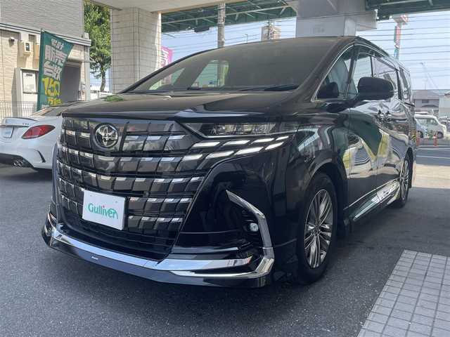 トヨタ アルファードハイブリット Z 愛知県 2024(令6)年 0.9万km ブラック ワンオーナー/モデリスタエアロキット/・フロント／サイド／リアアンダー／ドレスアップマフラー/黒合皮シート/前席2列目シートヒーター＆ベンチレーション/前席パワーシート/2列目エグゼクティブパワーシート/両側パワースライドドア/純正14型ディスプレイオーディオ/・車載ナビ／地デジTV／USB／HDMI/・Apple Car Play／Android Auto/パノラミックビューモニター〈床下透過表示機能〉/純正13.2型有機ELフリップダウンモニター/デジタルインナーミラー/ビルトインETC2.0/ワイヤレス充電/3眼LEDヘッドライト/純正18インチAW/TOYOTA SAFETY SENSE/・プリクラッシュセーフティ/・レーントレーシングアシスト/・レーンディパーチャーアラート/・全車速追従機能付レーダークルーズコントロール/・アダプティブハイビームシステム/・先行車発進告知/・プロアクティブドライビングアシスト/ブラインドスポットモニター/パーキングサポートブレーキ/スマートキー
