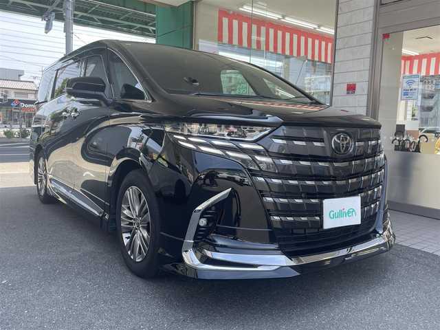トヨタ アルファードハイブリット Z 愛知県 2024(令6)年 0.9万km ブラック ワンオーナー/モデリスタエアロキット/・フロント／サイド／リアアンダー／ドレスアップマフラー/黒合皮シート/前席2列目シートヒーター＆ベンチレーション/前席パワーシート/2列目エグゼクティブパワーシート/両側パワースライドドア/純正14型ディスプレイオーディオ/・車載ナビ／地デジTV／USB／HDMI/・Apple Car Play／Android Auto/パノラミックビューモニター〈床下透過表示機能〉/純正13.2型有機ELフリップダウンモニター/デジタルインナーミラー/ビルトインETC2.0/ワイヤレス充電/3眼LEDヘッドライト/純正18インチAW/TOYOTA SAFETY SENSE/・プリクラッシュセーフティ/・レーントレーシングアシスト/・レーンディパーチャーアラート/・全車速追従機能付レーダークルーズコントロール/・アダプティブハイビームシステム/・先行車発進告知/・プロアクティブドライビングアシスト/ブラインドスポットモニター/パーキングサポートブレーキ/スマートキー