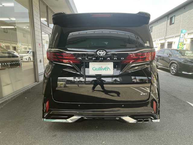 トヨタ アルファードハイブリット Z 愛知県 2024(令6)年 0.9万km ブラック ワンオーナー/モデリスタエアロキット/・フロント／サイド／リアアンダー／ドレスアップマフラー/黒合皮シート/前席2列目シートヒーター＆ベンチレーション/前席パワーシート/2列目エグゼクティブパワーシート/両側パワースライドドア/純正14型ディスプレイオーディオ/・車載ナビ／地デジTV／USB／HDMI/・Apple Car Play／Android Auto/パノラミックビューモニター〈床下透過表示機能〉/純正13.2型有機ELフリップダウンモニター/デジタルインナーミラー/ビルトインETC2.0/ワイヤレス充電/3眼LEDヘッドライト/純正18インチAW/TOYOTA SAFETY SENSE/・プリクラッシュセーフティ/・レーントレーシングアシスト/・レーンディパーチャーアラート/・全車速追従機能付レーダークルーズコントロール/・アダプティブハイビームシステム/・先行車発進告知/・プロアクティブドライビングアシスト/ブラインドスポットモニター/パーキングサポートブレーキ/スマートキー